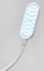 Lampka do maszyn szwalniczych HAIMU HM-12MD z 30 diodami LED, o owalnym kształcie i białej obudowie, mocowana na magnes. Elastyczny przewód umożliwia regulację pozycji. Tło proste, jasne, co podkreśla produkt.