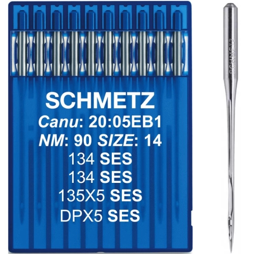 Igły Schmetz 90 z okrągłą kolbą 135x5 SES, umieszczone w niebieskim opakowaniu. Widoczne napisy: SCHMETZ, NM: 90 SIZE: 14, oraz numery 134 SES i 135X5 SES. Jedna igła na prawo od opakowania, z metalicznym wykończeniem.