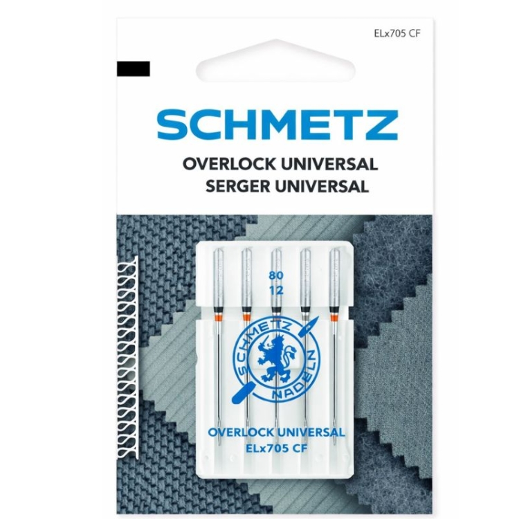 Igły półpłaskie Schmetz ELx705 SUK CF VCS do coverloków, pakowane w przezroczystym opakowaniu. Widoczne oznaczenia 80 i 12, logo Schmetz. Tło w odcieniach niebieskiego, z elementami tkanin.