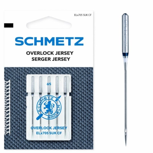 Igły półpłaskie Schmetz ELx705 SUK CF do coverloków, opakowanie z pięcioma igłami o długości 65 mm. Widoczne logo Schmetz, na białym tle z niebieskimi napisami. Igły mają metaliczny kolor, wystająca końcówka jest cienka i precyzyjna.