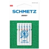 Igły półpłaskie Schmetz 130/705H SUK do jerseyu w zestawie 5 sztuk. W skład wchodzą igły o rozmiarach: 70, 80, 90. Opakowanie z widocznym logo Schmetz, umieszczone na zielonym tle z teksturą dzianiny.