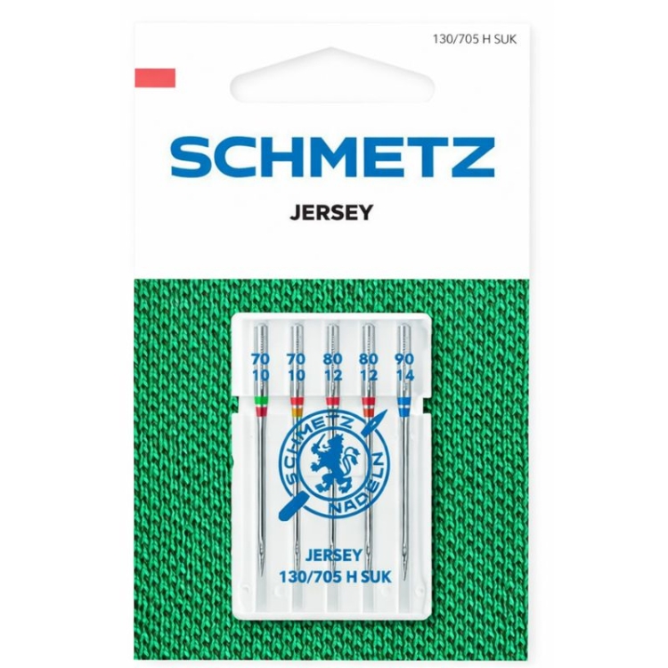 Igły półpłaskie Schmetz 130/705H SUK do jerseyu w zestawie 5 sztuk. W skład wchodzą igły o rozmiarach: 70, 80, 90. Opakowanie z widocznym logo Schmetz, umieszczone na zielonym tle z teksturą dzianiny.