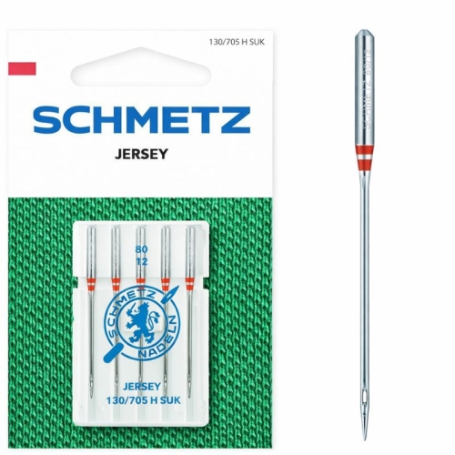 Igły półpłaskie Schmetz 130/705H SUK do jerseyu, rozmiar 80, w opakowaniu 5 sztuk. Widoczna kartonowa etykieta z napisem SCHMETZ JERSEY i logo z lwem. Igły mają metalowy korpus i charakterystyczny czerwony pasek na górze. Tło w kolorze zielonym.