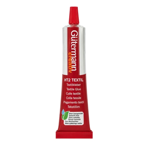 Klej tekstylny Gutermann HT2 TEXTIL pokazany na białym tle. Zdjęcie prezentuje smukłą tubkę z precyzyjną końcówką, czerwono-białą etykietą oraz oznaczeniem produktu przeznaczonego do klejenia tkanin.
