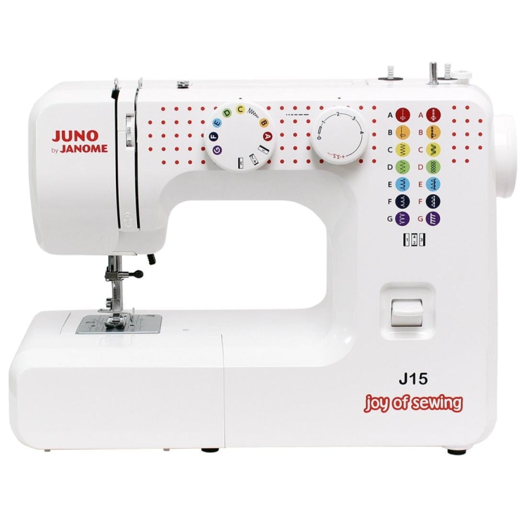 Maszyna do szycia Janome JUNO J15 w białej obudowie, z pokrętłami do wyboru ściegów i funkcji. Widoczny napis joy of sewing oraz logo Janome. Stojąca, frontalnie ukazana, z widocznym miejscem na igłę i stopkę.