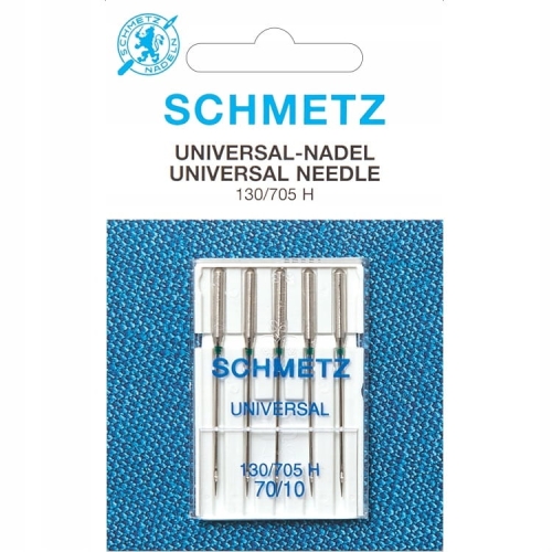Igły półpłaskie Schmetz 130/705H w opakowaniu pięciu sztuk. Igły mają metalowy trzonek, z oznaczeniem 70/10 oraz zieloną końcówkę, umieszczone na białym tle z napisem SCHMETZ i UNIVERSAL. Opakowanie z przezroczystego plastiku.