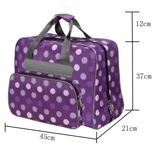 Fioletowa torba w kropki na maszynę do szycia, z wymiarami 45 cm x 21 cm x 37 cm. Posiada szare uchwyty i zamek błyskawiczny oraz zewnętrzną kieszeń. Wzór w kropki w odcieniach fioletu i jasnego różu.