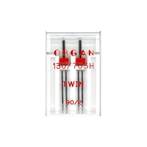 Igła podwójna półpłaska 130/705H Organ TWIN 90/2mm, 2 sztuki w przezroczystym opakowaniu. Widoczne dwa metalowe groty igieł z czerwonymi uchwytami. Na opakowaniu widnieją napisy: ORGAN, TWIN, 130/705H, 90/2.
