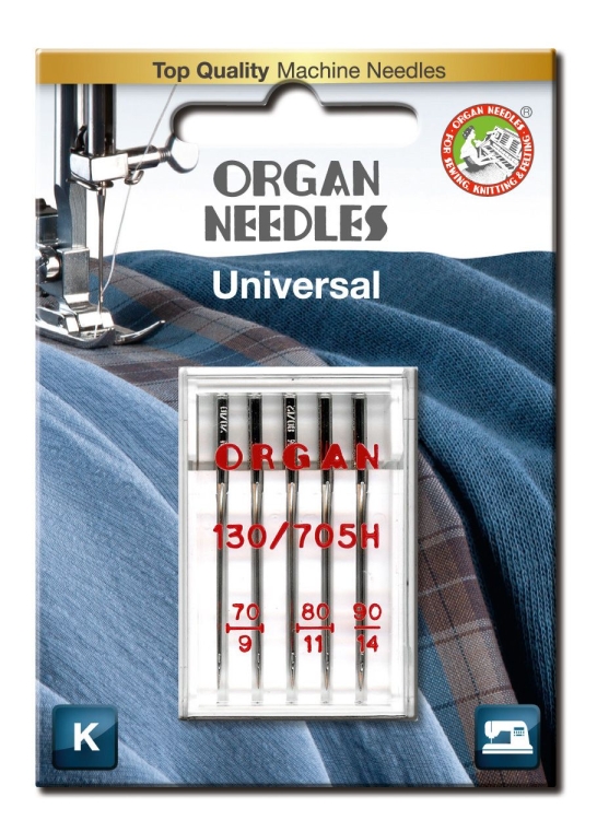 Igły półpłaskie ORGAN 130/705H w opakowaniu blistra, zawierające 5 sztuk o rozmiarach 70, 80 i 90. Widoczne są na tle niebieskiego i szarego materiału. W blistrze nadrukowane logo ORGAN oraz informacje o rozmiarach igieł.