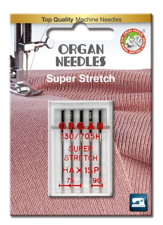 Igły półpłaskie Organ HAx1SP do stretchu w mixie rozmiarów 75-90, umieszczone w przezroczystym blistrze. Widoczny napis Super Stretch oraz oznaczenia rozmiarów. Tło w odcieniu różowym z fakturą materiału.