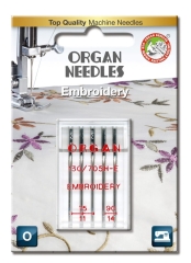 Igły półpłaskie Organ 130/705H-E do haftu w blistrze, zawierające igły o rozmiarach 75 i 90. Opakowanie z przezroczystego plastiku, z widocznym logo ORGAN NEEDLES oraz oznaczeniem EMBROIDERY. Tło z delikatnym wzorem haftu.
