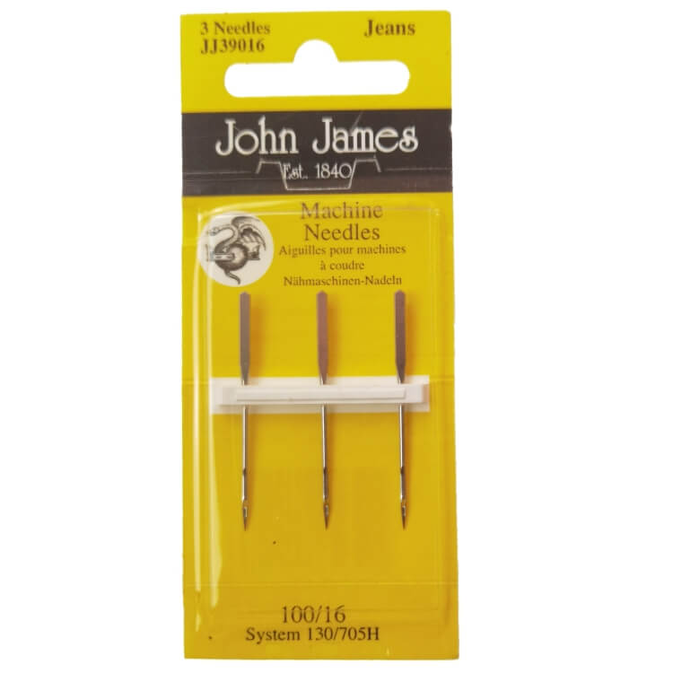 Igły półpłaskie do jeansu John James 130/705H, rozmiar 100, w opakowaniu 3 sztuki. Widoczne metalowe końcówki igieł z brązowymi uchwytami, na żółtym tle z nadrukiem. Opakowanie z przezroczystym frontem, z czytelnymi napisami i logo producenta.