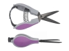 Nożyczki tapicerskie TEXI Titanium Ti613 o długości 16 cm, z ergonomicznymi uchwytami w szaro-różowym kolorze. Widoczna sprężyna, metalowe ostrza w kolorze ciemnoszarym, z logo TEXI. Ujęcie z boku, nożyczki otwarte, gotowe do użycia.